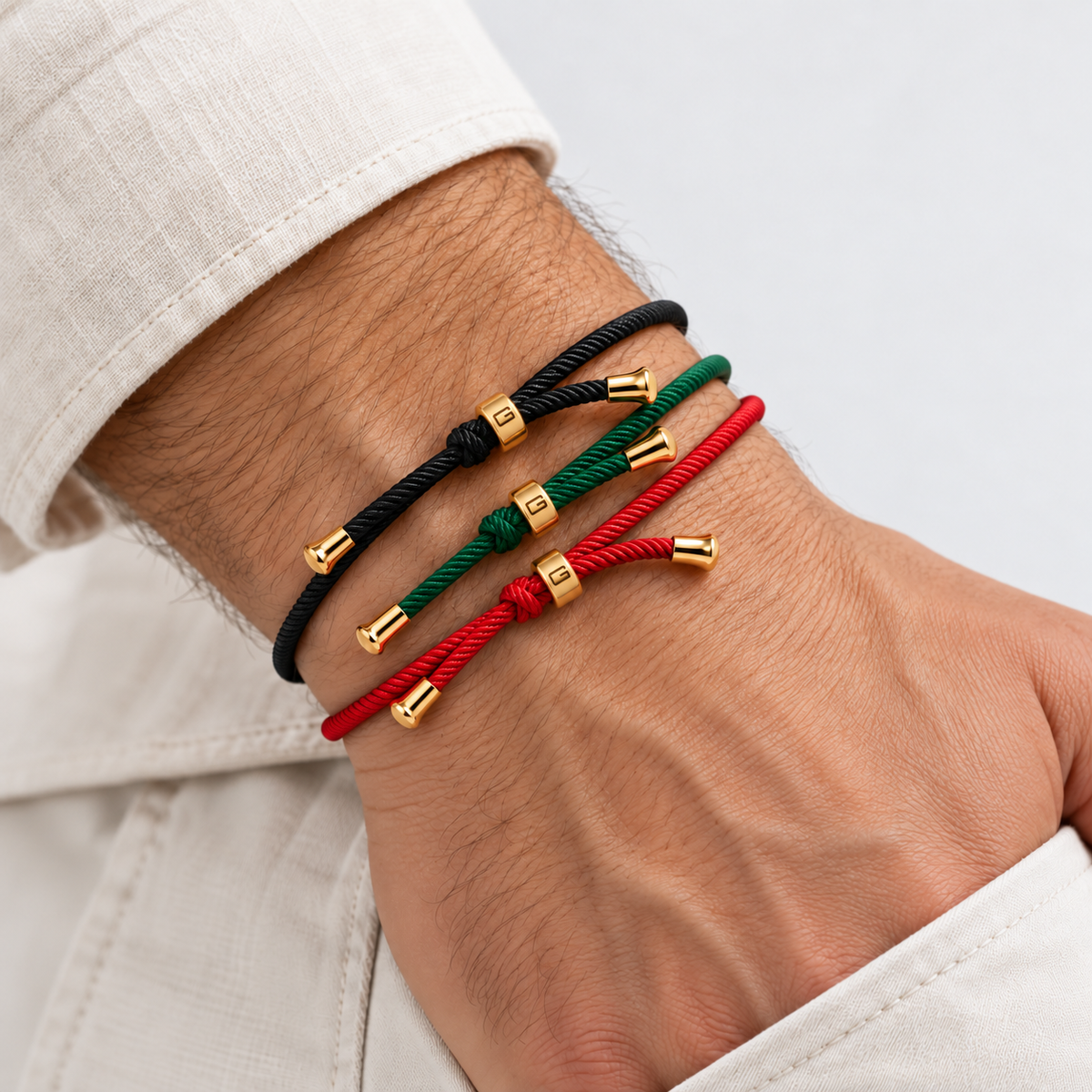 Greyford Formentera Adjustable Cotton Cord Bracelet Pack — worn by a model, close-up studio photograph