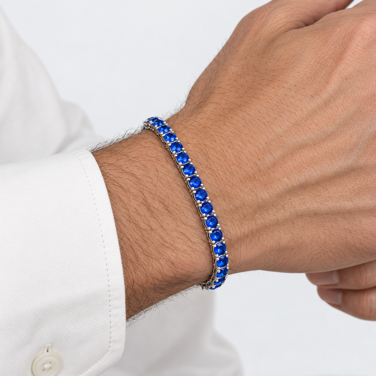 Greyford Riviera Blue Cubic Zirconia Tennis Bracelet — worn by a model, close-up studio photograph