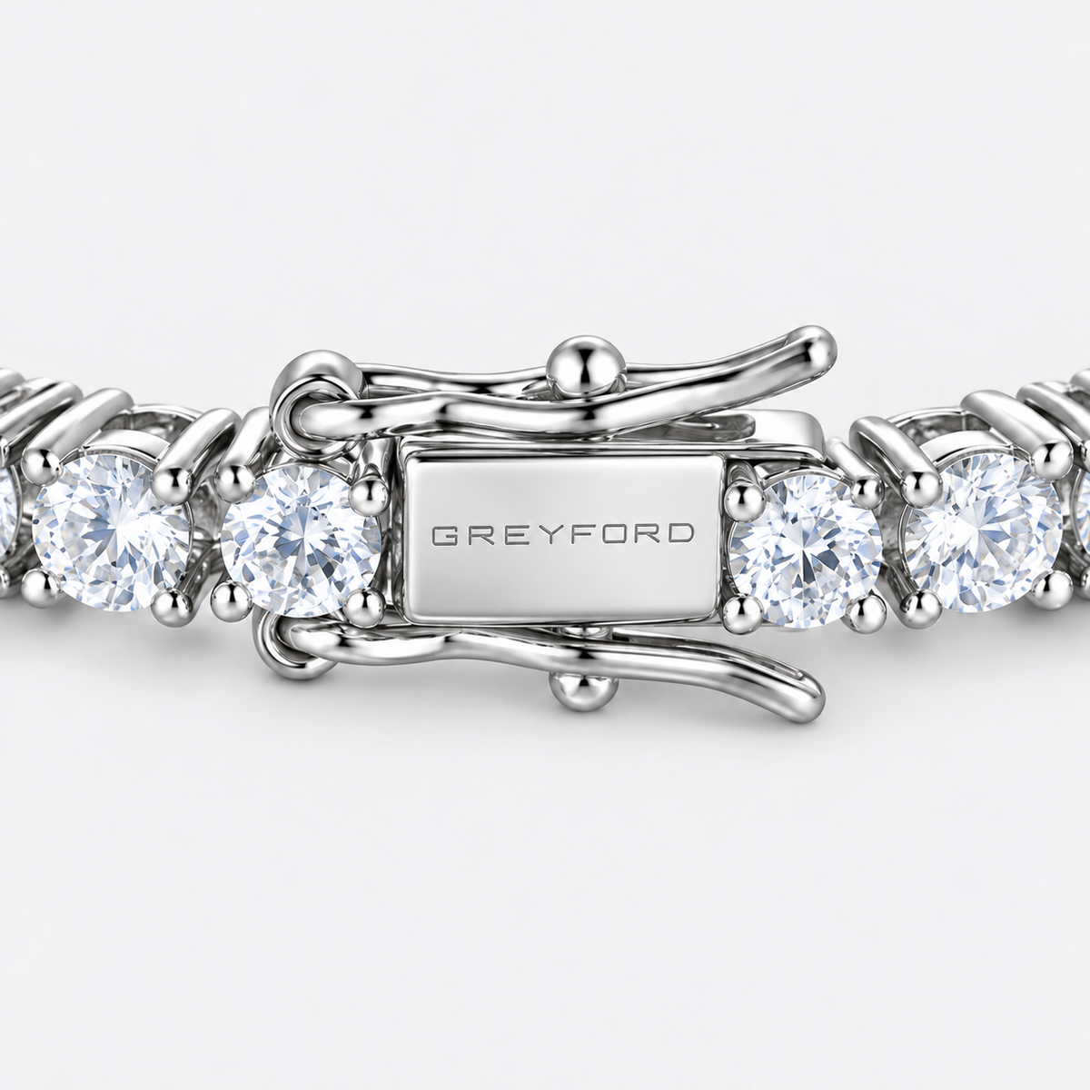 Greyford Zermatt Clear Moissanite Tennis Bracelet — close-up of the piece and brand engraving