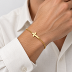 GREYFORD Minimal Cross Bracelet — worn by a model, close-up studio photograph