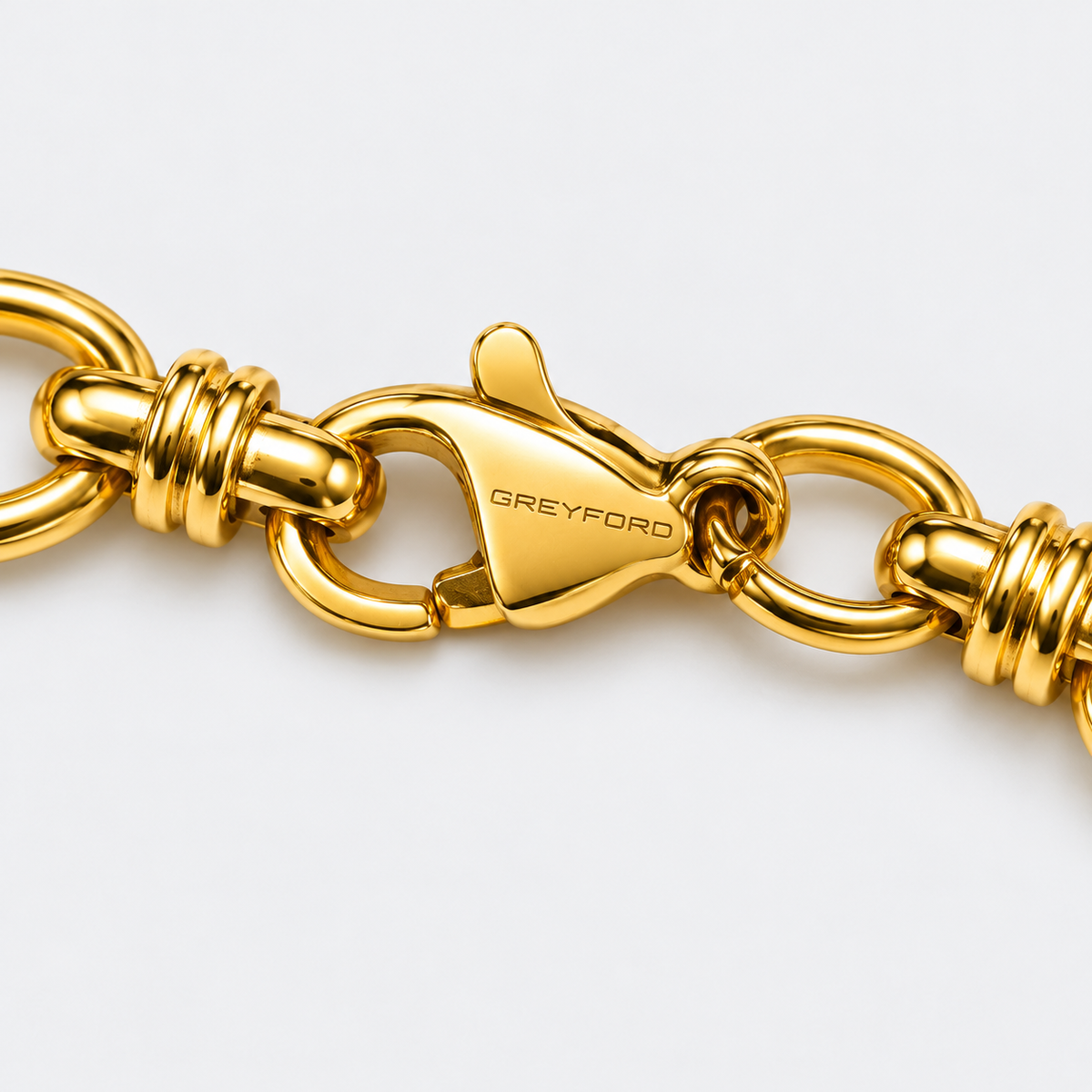 Greyford Como Oval Link Bracelet — close-up of the piece and brand engraving